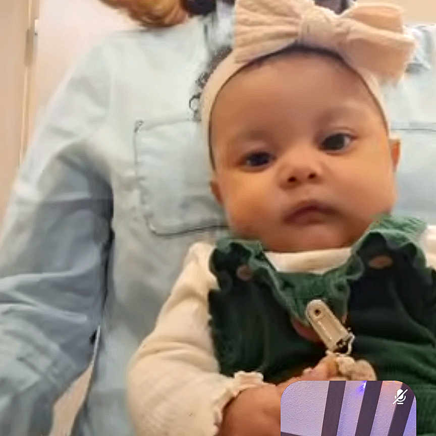 Isabella Swain joined the competition — help win amazing prizes! baby, bow, casual_clothing, child, communication, expression, face, glasses, headband, holding, indoor, inset, interaction, light, person, portrait, room, technology, video_call, woman