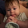 Millie is registered to the contest to win money with this photo: baby, infant, face, hands, blanket, clothing, person, indoor, closeup, expression, skin, hair, lap, comfort, soft, texture, curious, young, human, resting