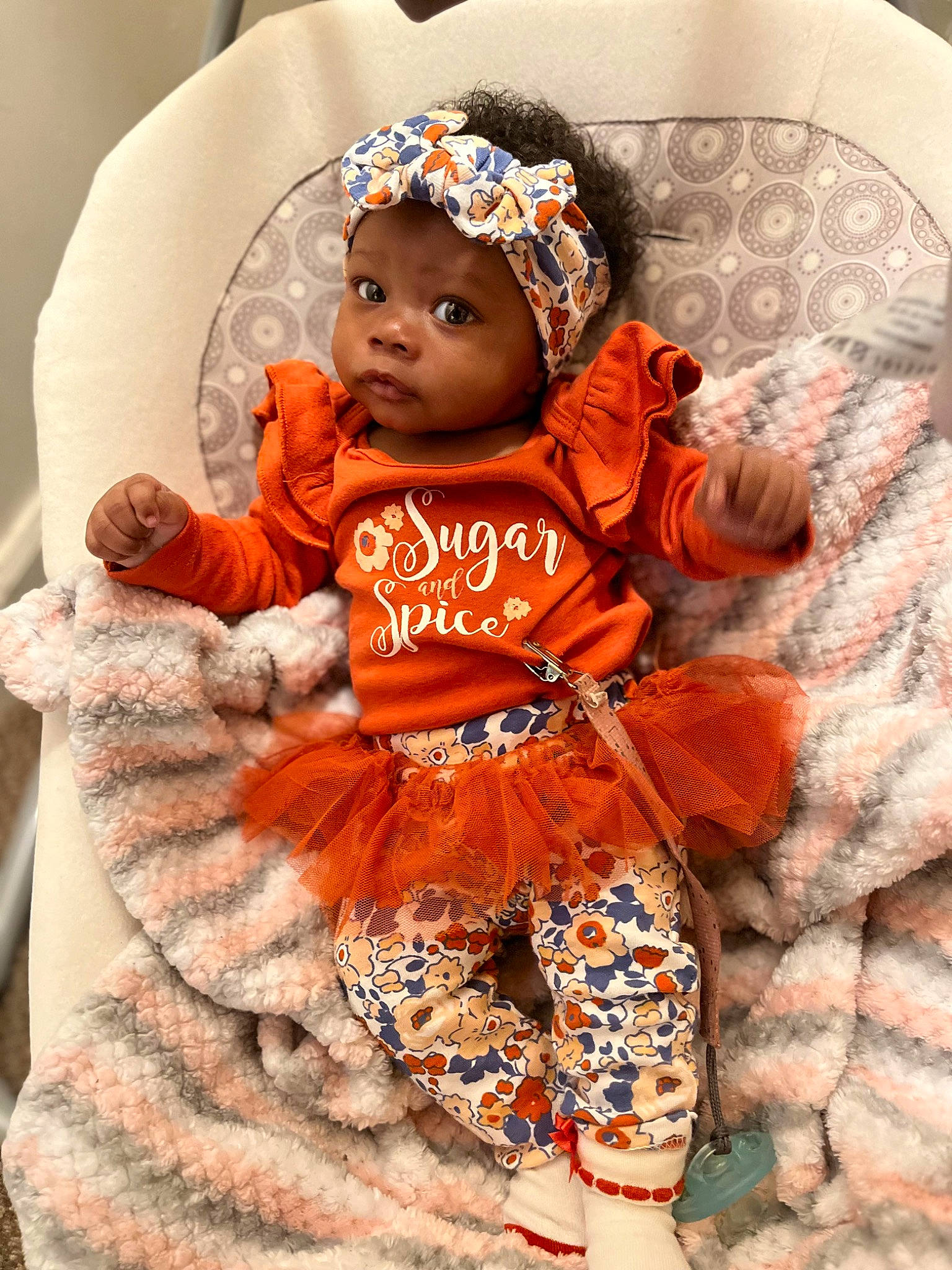 Kailah joined the competition — help win amazing prizes! baby, baby_products, baby_sleeping, baby_toddler_clothing, beanie, child, costume, fashion_accessory, happy, headband, headwear, knit_cap, orange, pattern, peach, people, person, pink, sitting, sleeve