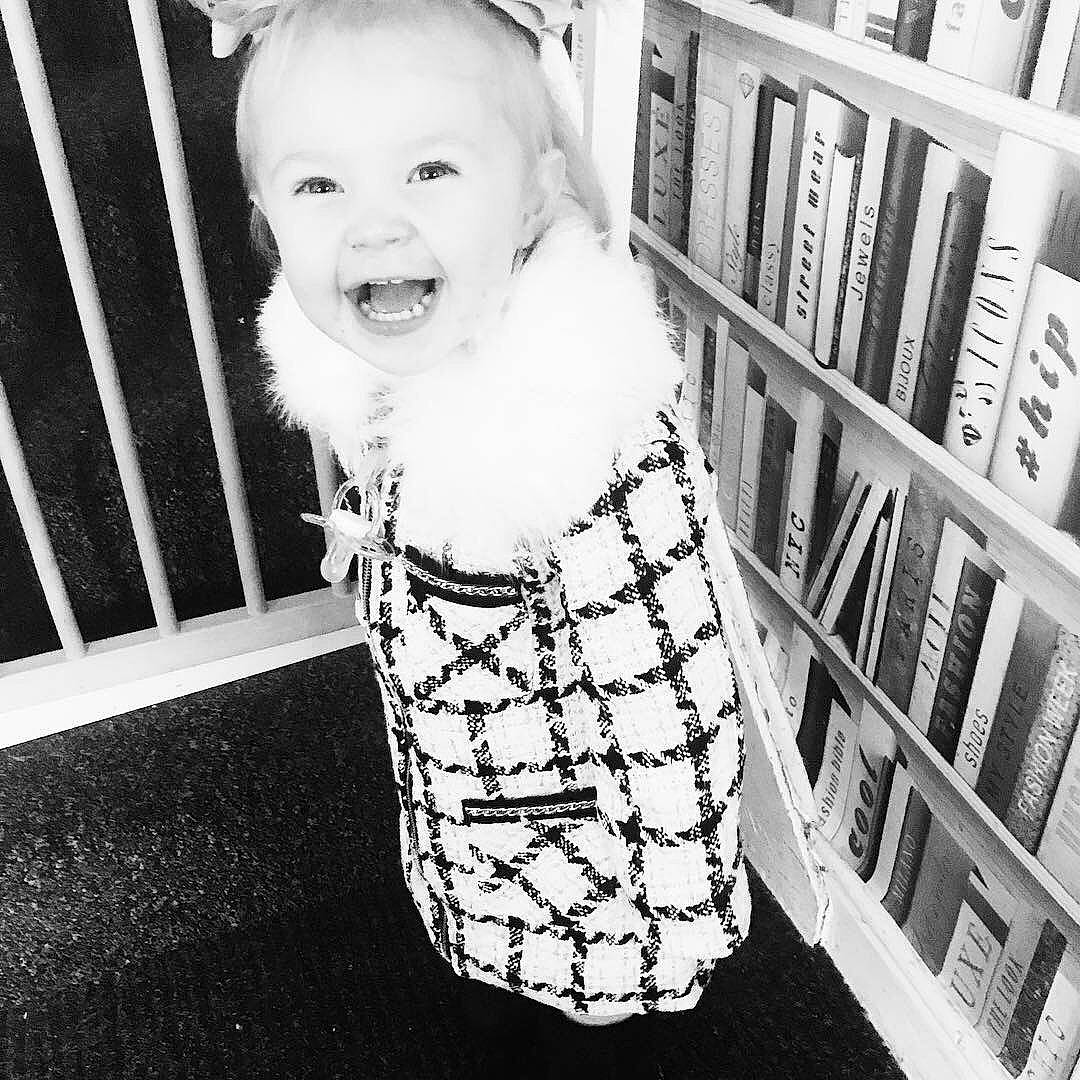 Scarlett is registered to the contest to win money with this photo: baby, black, black_and_white, child, design, dress, family, head, headwear, monochrome, monochrome_photography, outerwear, pattern, person, photography, product, sleeve, smile, style, toddler