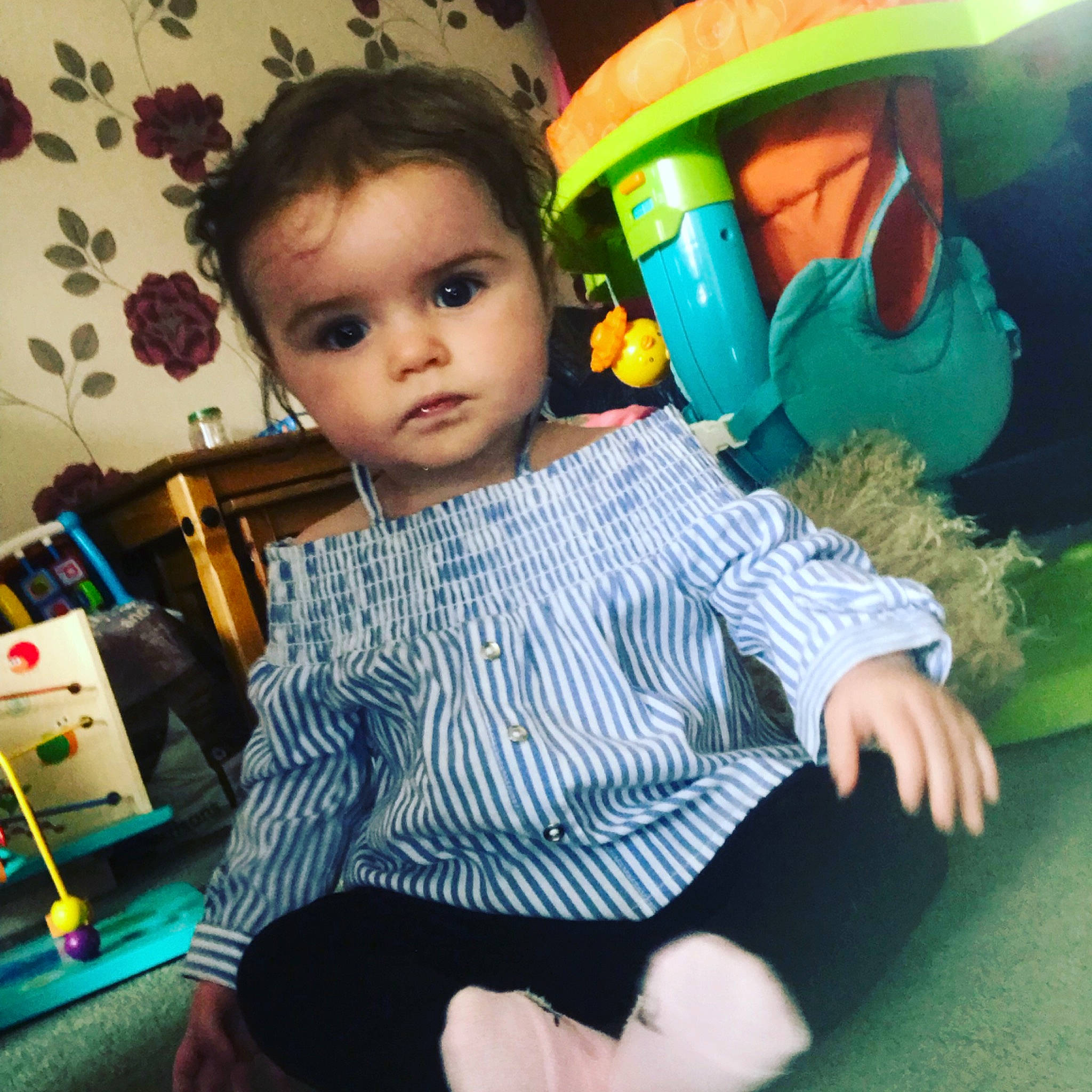 Hallie-rose is registered to the contest to win money with this photo: arm, baby, cheek, child, cool, eye, face, green, happy, head, neck, nose, person, play, product, sitting, skin, sleeve, smile, t_shirt