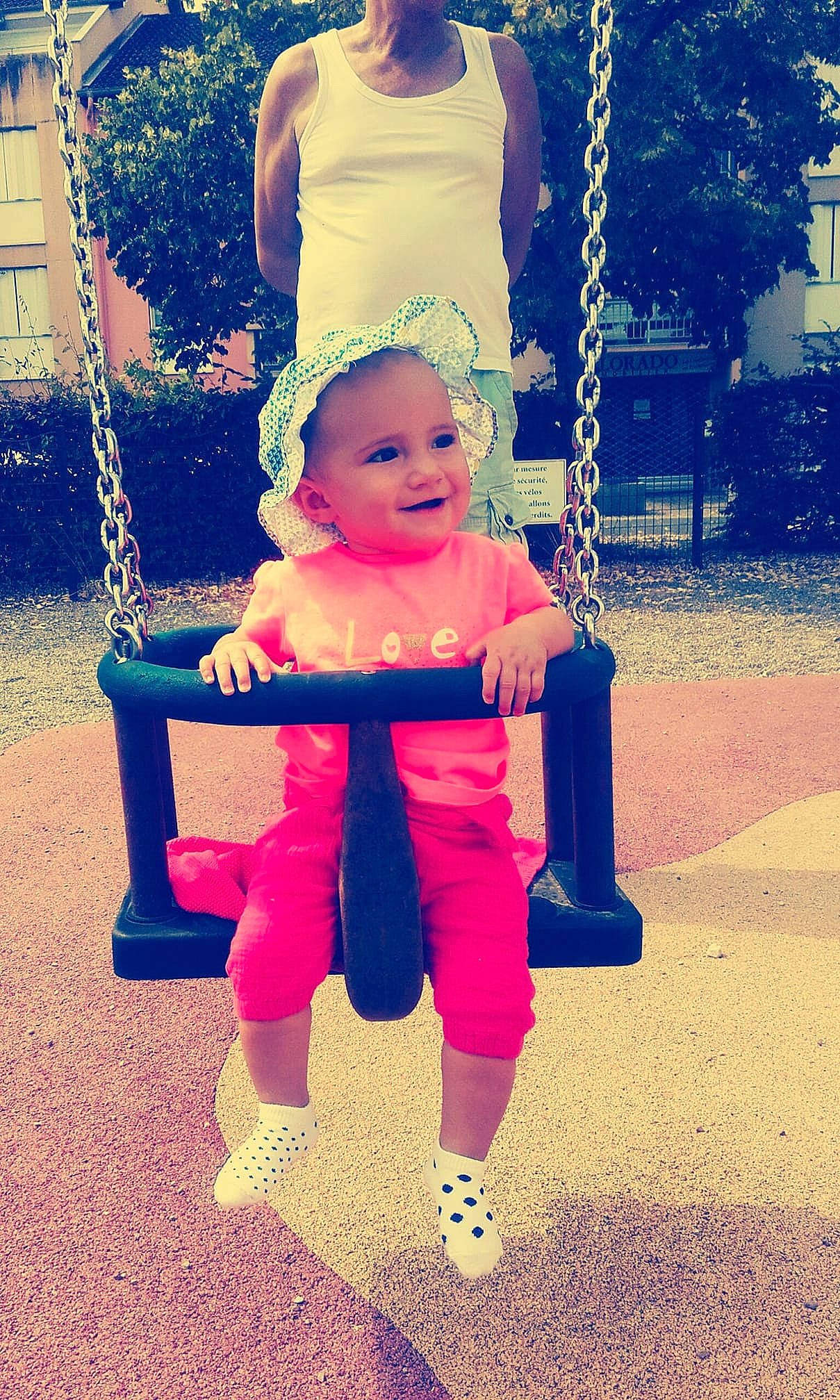 Luna participe au concours pour gagner de l'argent avec cette photo : blue, child, day, facial_expression, fun, girl, happiness, joy, outdoor_play_equipment, person, pink, play, playground, product, public_space, purple, recreation, smile, standing, summer