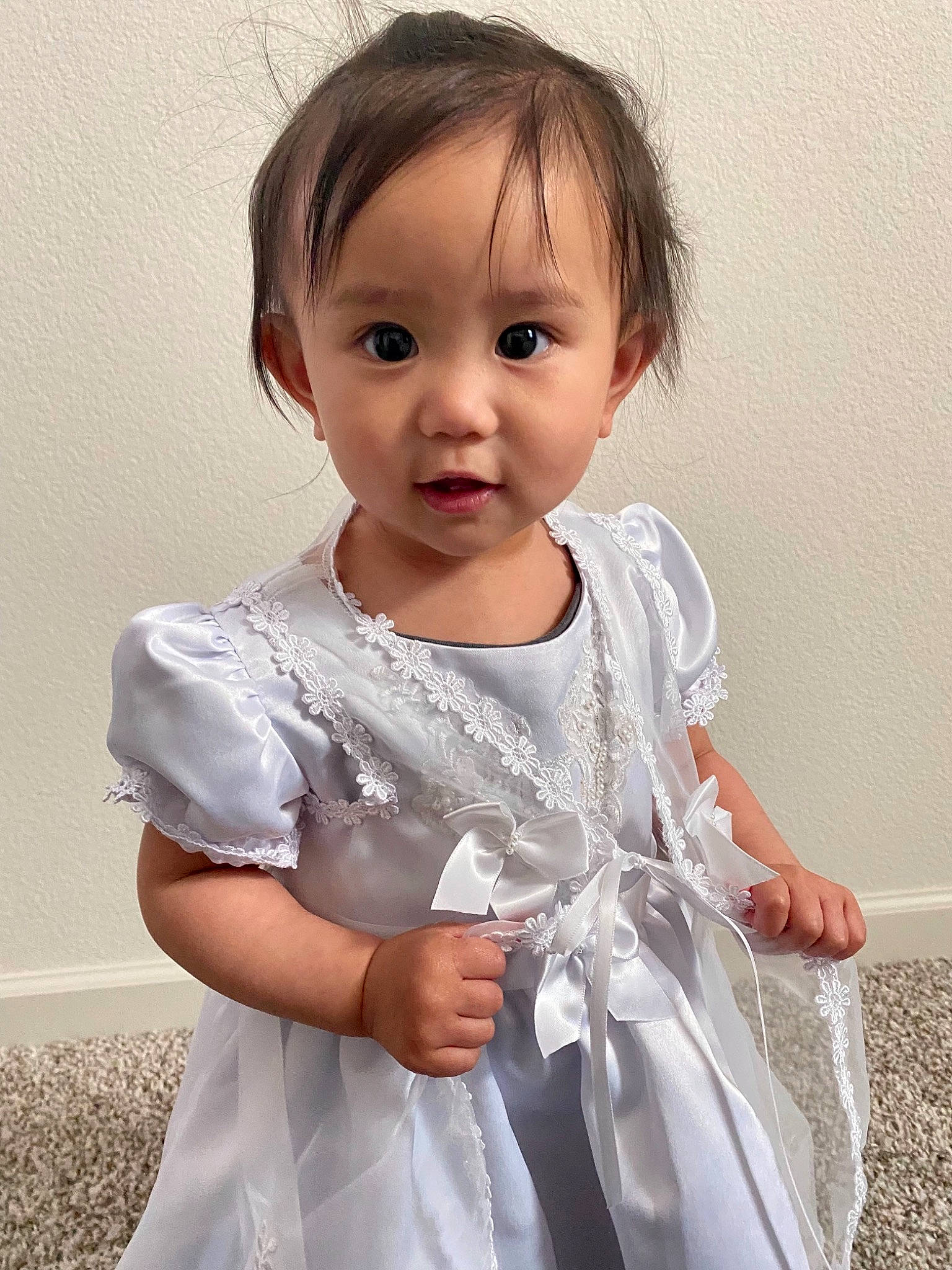 Jazmine is registered to the contest to win money with this photo: baby_toddler_clothing, day_dress, dress, embellishment, eyelash, face, fashion_design, gesture, hair, happy, human_body, iris, jewellery, lip, neck, one_piece_garment, person, product, shoulder, sleeve