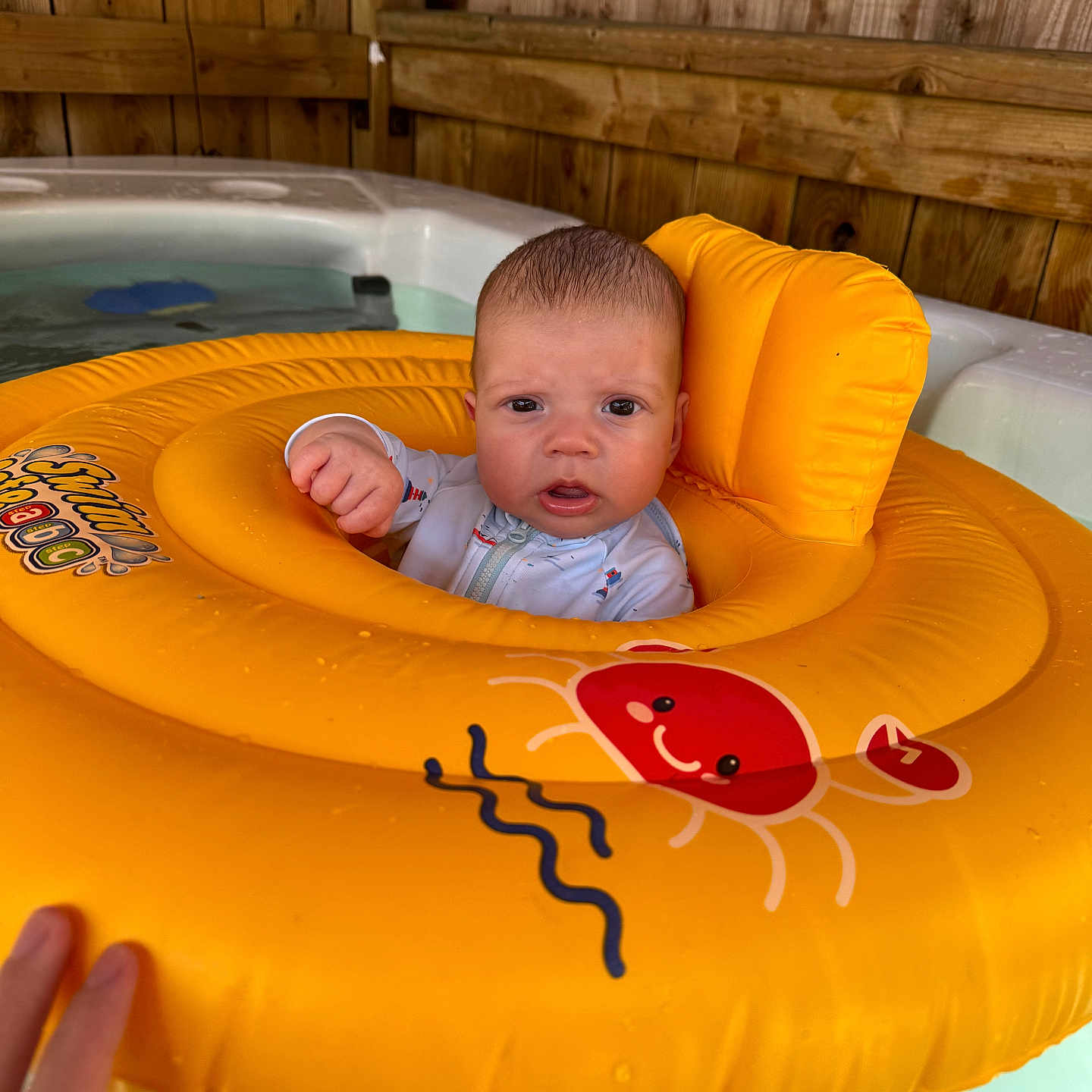 Archie-John joined the competition — help win amazing prizes! baby, bodypart, clothing, face, finger, hand, head, hottub, inflatable, lifejacket, newborn, person, photography, pool, portrait, summer, tub, tubing, vest, water