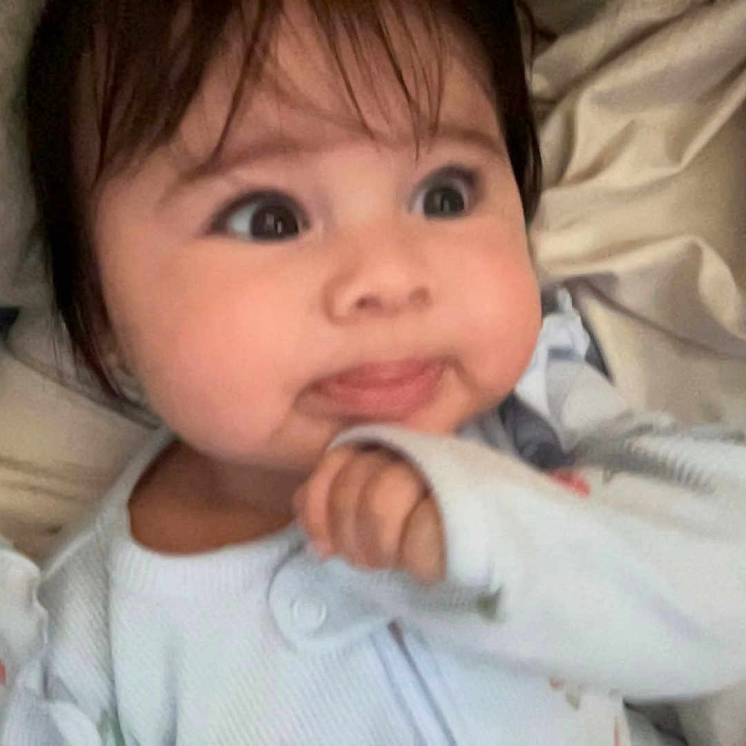 Vivianne joined the competition — help win amazing prizes! baby, bodypart, clothing, coat, couch, cushion, cutlery, face, finger, furniture, hand, happy, head, homedecor, newborn, person, photography, portrait, smile, spoon