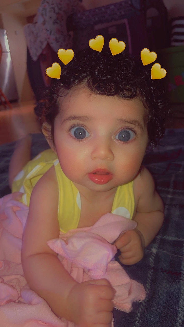 Kyla joined the competition — help win amazing prizes! baby_toddler_clothing, cap, cheek, chin, ear, eyebrow, eyelash, hairstyle, hand, happy, iris, lip, nose, organ, person, pink, product, skin, surprise, textile