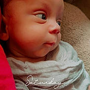 Alexzander is registered to the contest to win money with this photo: baby, infant, face, portrait, wrapped, cloth, blanket, red, soft, skin, cute, small, child, newborn, gaze, eyes, indoors, cozy, closeup, toddler