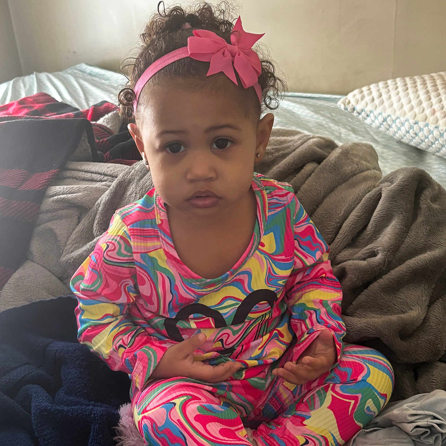 Taylee joined the competition — help win amazing prizes! accessories, baby, bed, blanket, bodypart, couch, cushion, face, finger, furniture, hand, happy, head, headband, homedecor, person, photography, portrait, sitting, smile