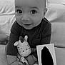 Namron participe au concours pour gagner de l'argent avec cette photo : baby, child, plush_toy, couch, sitting, smiling, indoors, hand, footwear, card, black_and_white, cute, portrait, young_child, happy, soft_toy, cozy, infant, face, person