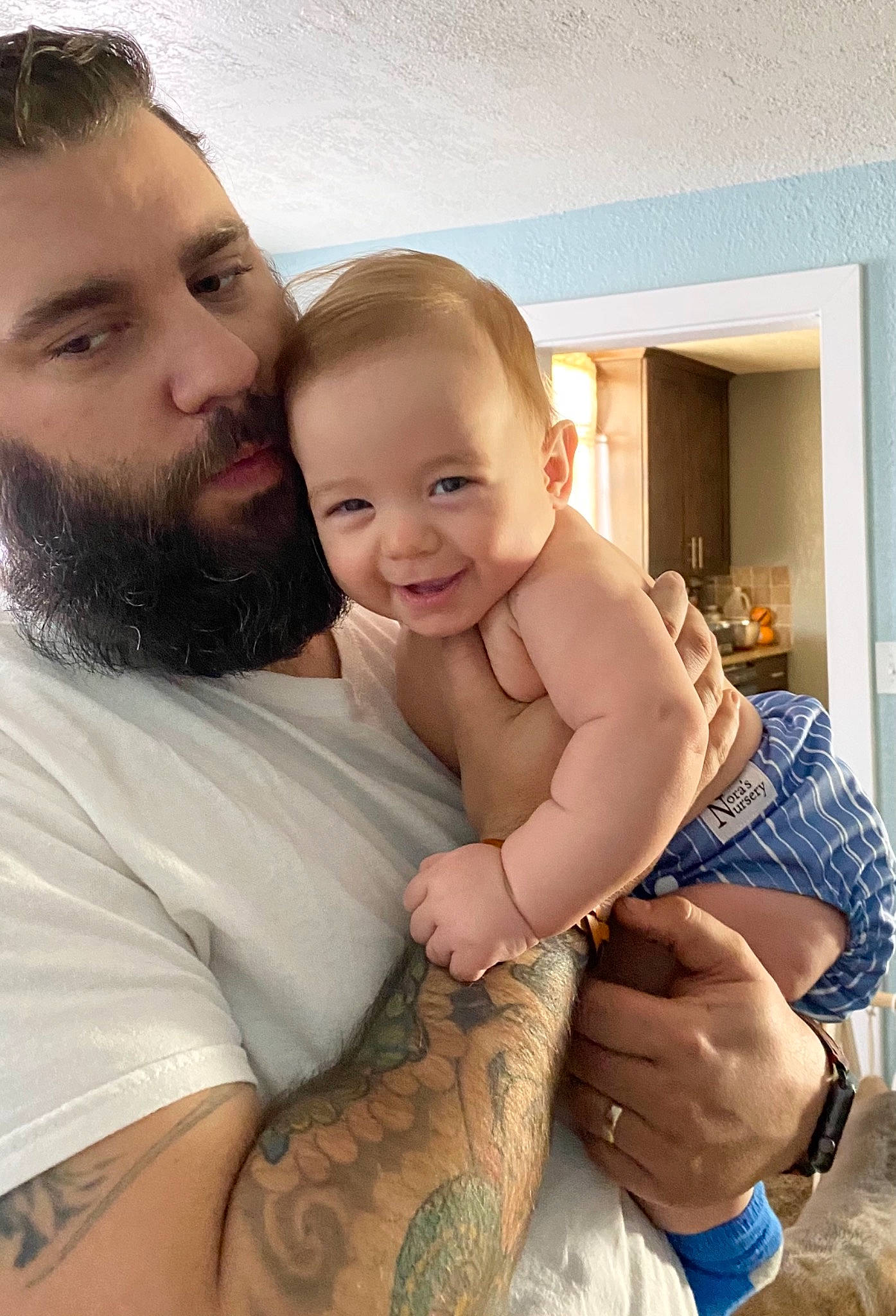 Malakai is registered to the contest to win money with this photo: arm, beard, chin, eye, face, finger, gesture, hand, happy, human, iris, joint, joy, mouth, muscle, neck, organ, person, shorts, shoulder