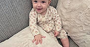 Kali joined the competition — help win amazing prizes! baby, child, couch, cozy, cute, face, foot, furniture, hand, happy, home, indoor, infant, pajamas, person, pillow, plush, relaxing, smile, soft