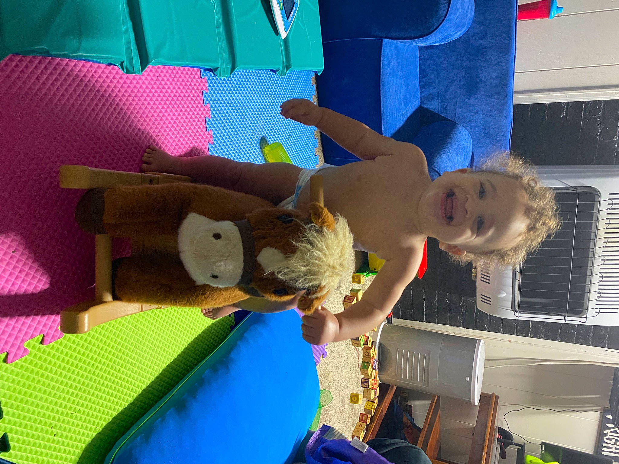 Jamie is registered to the contest to win money with this photo: animation, art, baby, blue, bounce_house, child, electric_blue, fun, happy, inflatable, joy, leisure, magenta, outdoor_play_equipment, pattern, person, play, recreation, room, smile