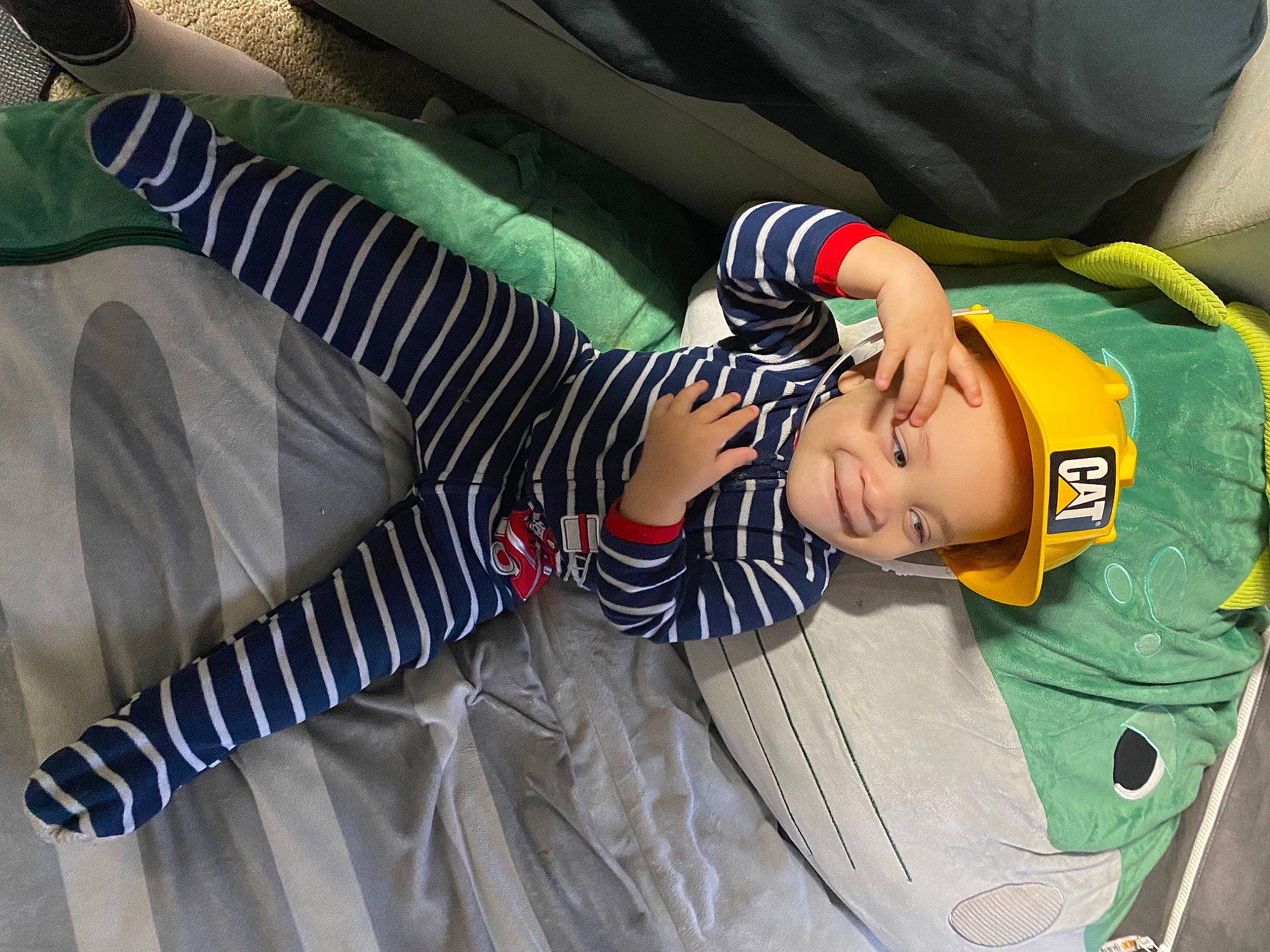 Jamie joined the competition — help win amazing prizes! baby, baby_products, child, comfort, couch, elbow, fun, human_leg, joy, pattern, person, room, sitting, sleeve, sock, thigh, toddler