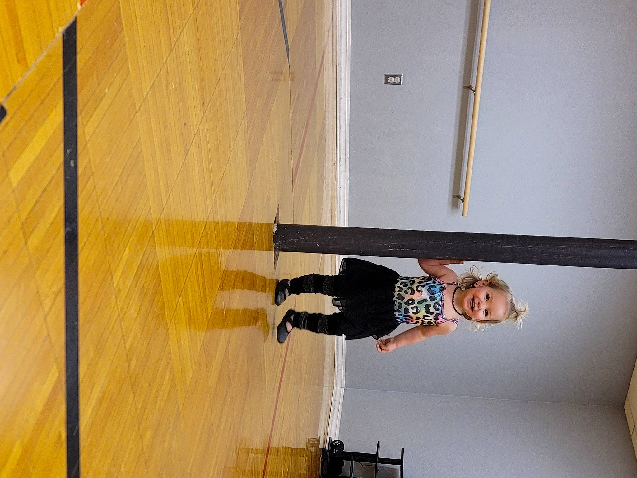 Nova is registered to the contest to win money with this photo: ceiling, cleanliness, door, floor, flooring, hardwood, joy, laminate_flooring, leg, person, plank, plywood, room, shadow, smile, stairs, varnish, waist, window, wood