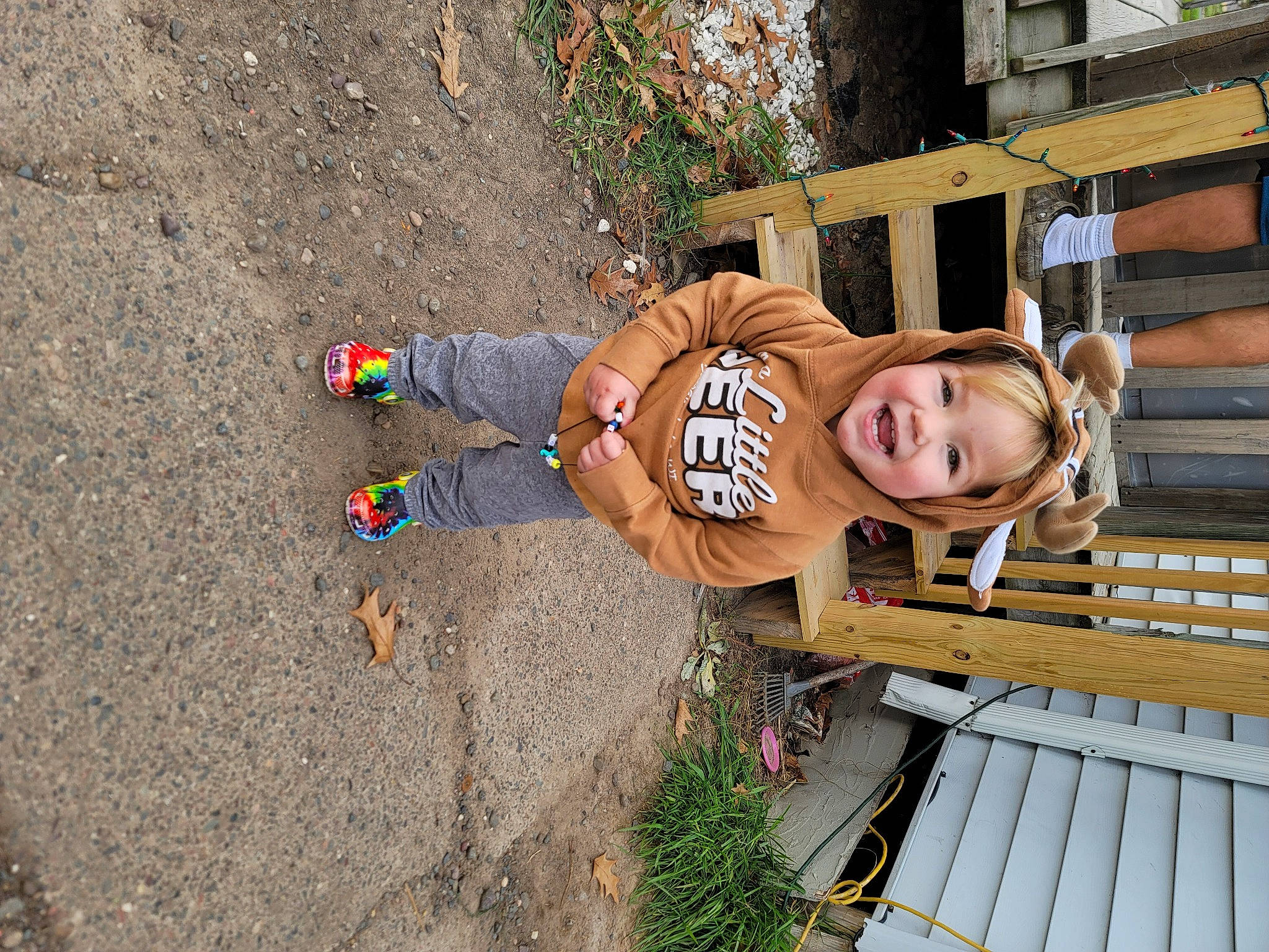 Nova is registered to the contest to win money with this photo: child, fun, joy, leisure, outdoor_shoe, person, plant, recreation, smile, soil, t_shirt, toddler, tree, walking_shoe, wood