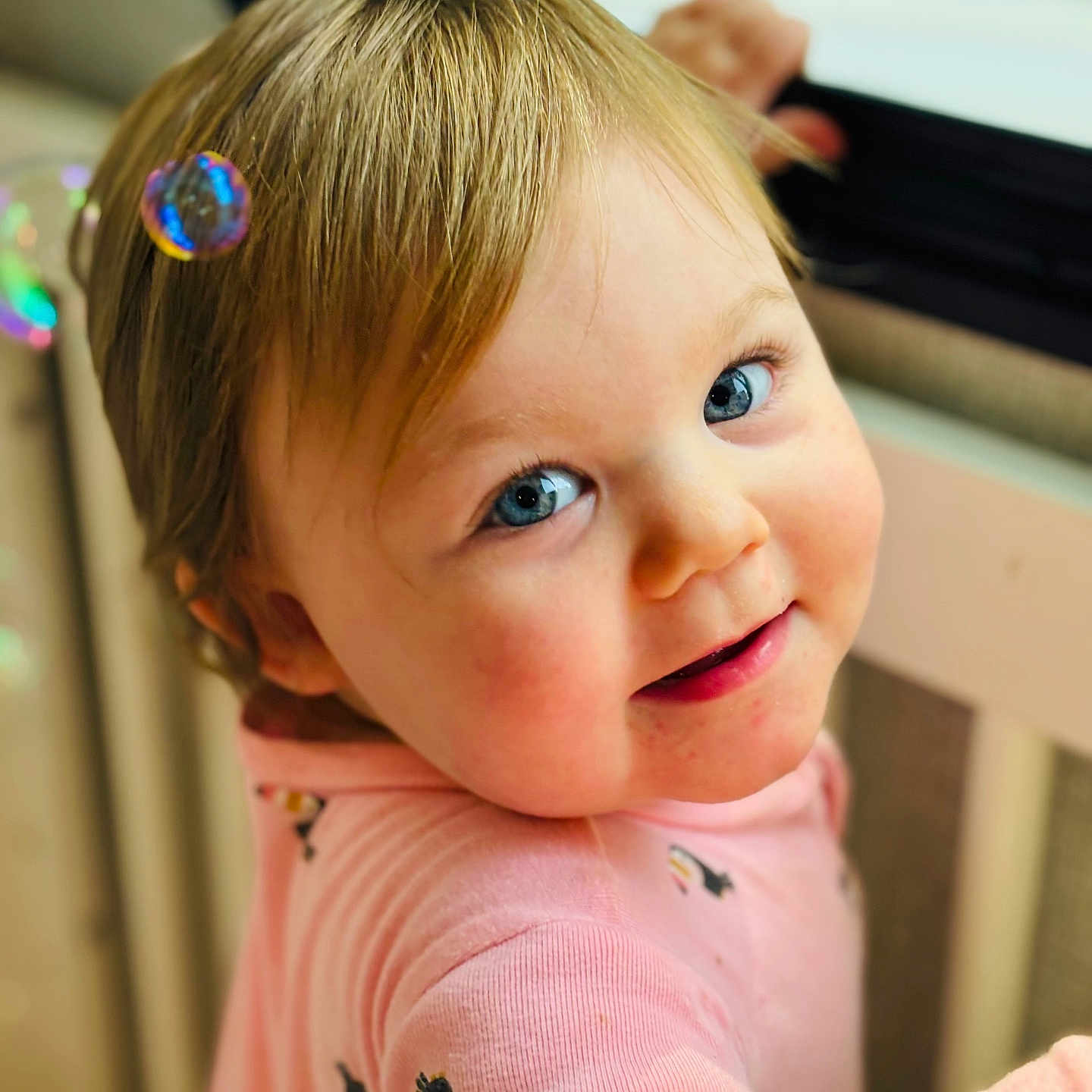 Jemmalynn joined the competition — help win amazing prizes! baby, blonde_hair, blue_eyes, bubble, child, closeup, clothing, cute, face, happy, indoor, long_sleeve, person, pink_clothing, portrait, skin, smiling, toddler, window, young_child