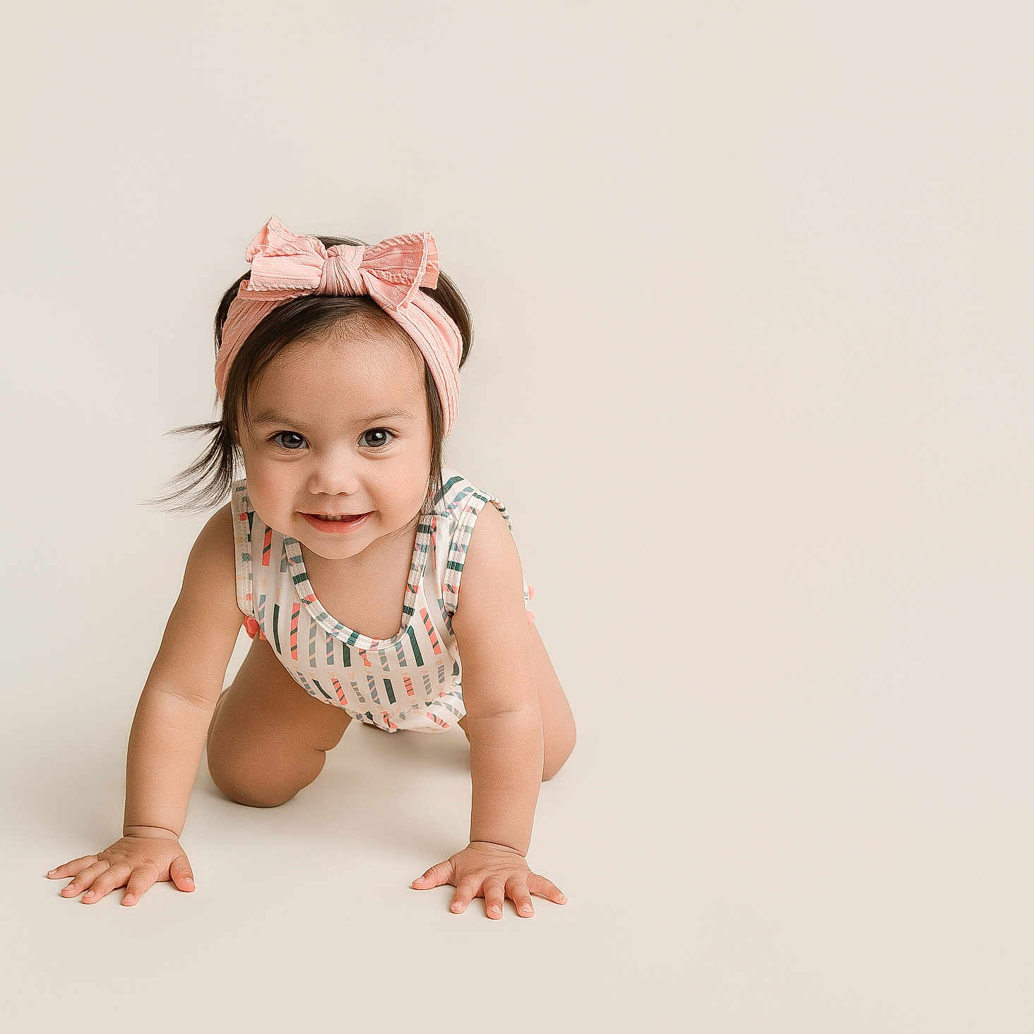 Anastasia is registered to the contest to win money with this photo: baby, child, crawling, smiling, headband, pink_bow, onesie, cute, infant, happy, portrait, minimalistic, studio, baby_girl, hands, face, eyes, hair, skin, indoor