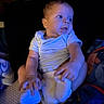 baby, infant, child, blue_light, sitting, diaper, onesie, blanket, indoor, cute, portrait, human, skin, hand, foot, expression, head, face, eyes, soft_lighting