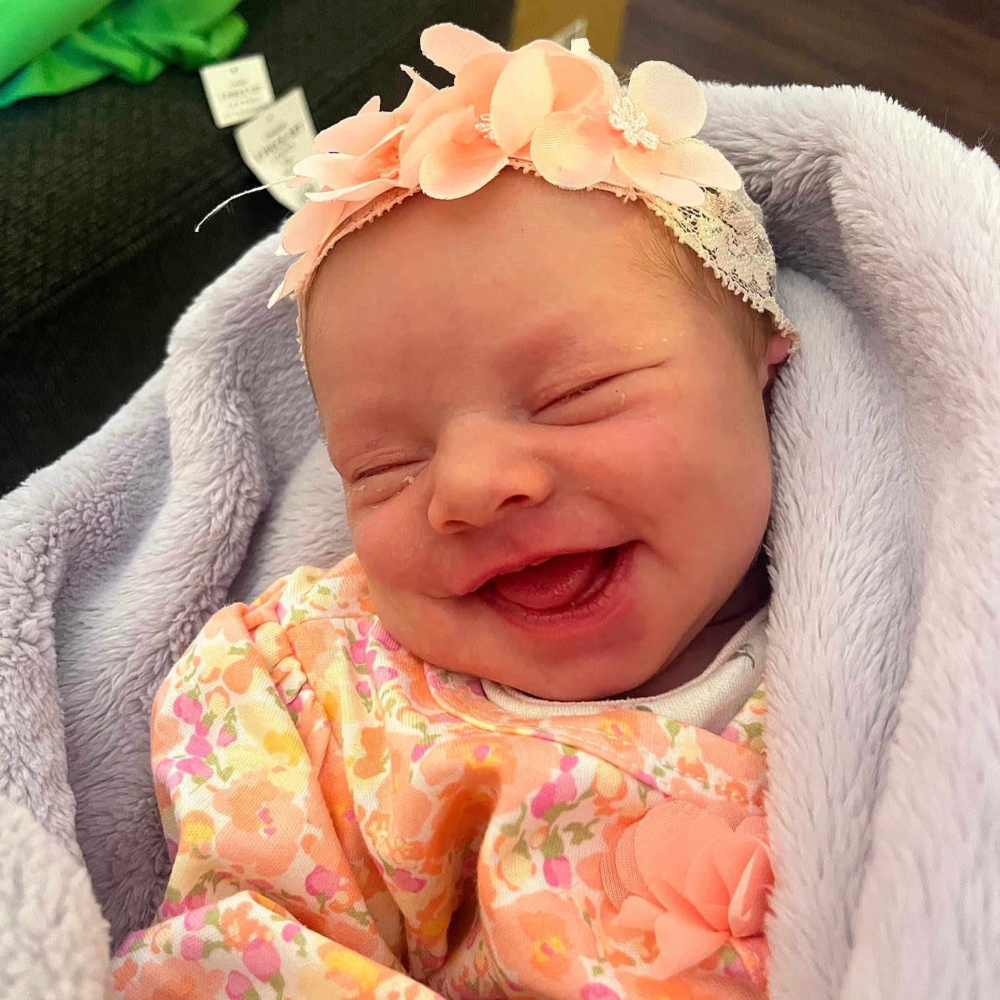 Heavenley joined the competition — help win amazing prizes! baby, blanket, child, clothing, cozy, cute, face, floral_outfit, flower_headband, happy, head, indoor, infant, newborn, peaceful, portrait, sleepy, smiling, soft_texture, wrapped
