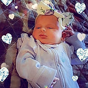 Hazel is registered to the contest to win money with this photo: baby, infant, bow, onesie, blanket, heart_effects, sleeping, cute, child, portrait, cozy, soft_lighting, indoor, baby_girl, headwear, quilt, peaceful, adorable, closeup, newborn