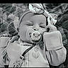 baby, pacifier, headband, bow, blanket, infant, cute, portrait, clothing, hand, face, sleepy, black_and_white, texture, soft, lying_down, child, adorable, cozy, newborn