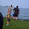 Jj joined the competition — help win amazing prizes! adult, boat, casual, child, daytime, grass, lake, nature, outdoor, people, recreation, running, shoes, shoreline, shorts, sky, summer, trees, tshirt, water
