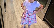 Layla Montoya joined the competition — help win amazing prizes! child, girl, sunglasses, kitchen, floor, dress, floral_skirt, sandals, hair_tie, standing, appliance, oven, refrigerator, cabinet, countertop, light, indoor, person, confident, pose