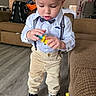 Gabriel joined the competition — help win amazing prizes! bow_tie, boy, child, clothing, couch, cute, earrings, floor, focused, furniture, hairstyle, indoors, living_room, pants, person, sneakers, standing, suspenders, toddler, toy