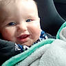 baby, smiling, blanket, blue_eyes, car_seat, child, face, happy, cute, infant, cozy, cheeks, portrait, clothing, soft, indoor, warm, comfort, toddler, seat