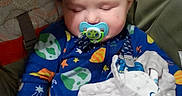 James joined the competition — help win amazing prizes! baby, sleeping, pacifier, blanket, onesie, space_theme, seat, child, infant, cute, comfort, clothing, indoor, rest, peaceful, young_child, soft_texture, colorful, portrait, babygear