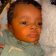 Jedidiah joined the competition — help win amazing prizes! baby, infant, face, eyes, blanket, onesie, clothing, cute, sleepwear, soft_texture, newborn, portrait, closeup, child, resting, indoors, cozy, skin, expression, comfort