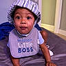 baby, toddler, child, hat, bib, crawling, bed, indoor, cute, expression, person, clothing, striped_hat, mister_little_boss, skin, hand, face, eyes, mouth, young_child