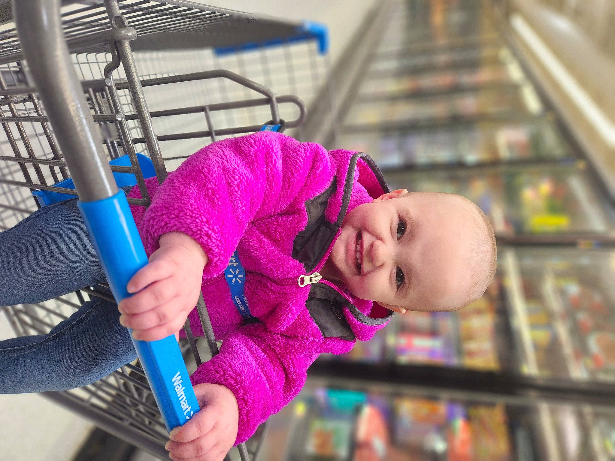 Everlee is registered to the contest to win money with this photo: baby, baby_products, baby_toddler_clothing, child, city, clothing, electric_blue, fun, happy, joy, leisure, magenta, outdoor_play_equipment, person, purple, recreation, shopping_cart, smile, swing, toddler