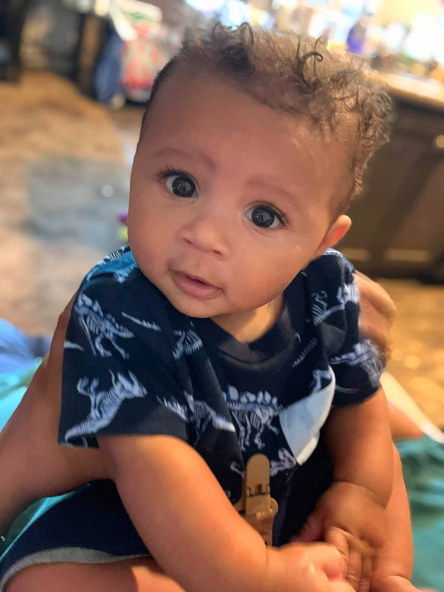 Deshawne is registered to the contest to win money with this photo: baby, cheek, child, electric_blue, fun, grass, hairstyle, happy, human_leg, iris, leisure, person, play, sitting, skin, smile, soil, t_shirt, thigh, toddler