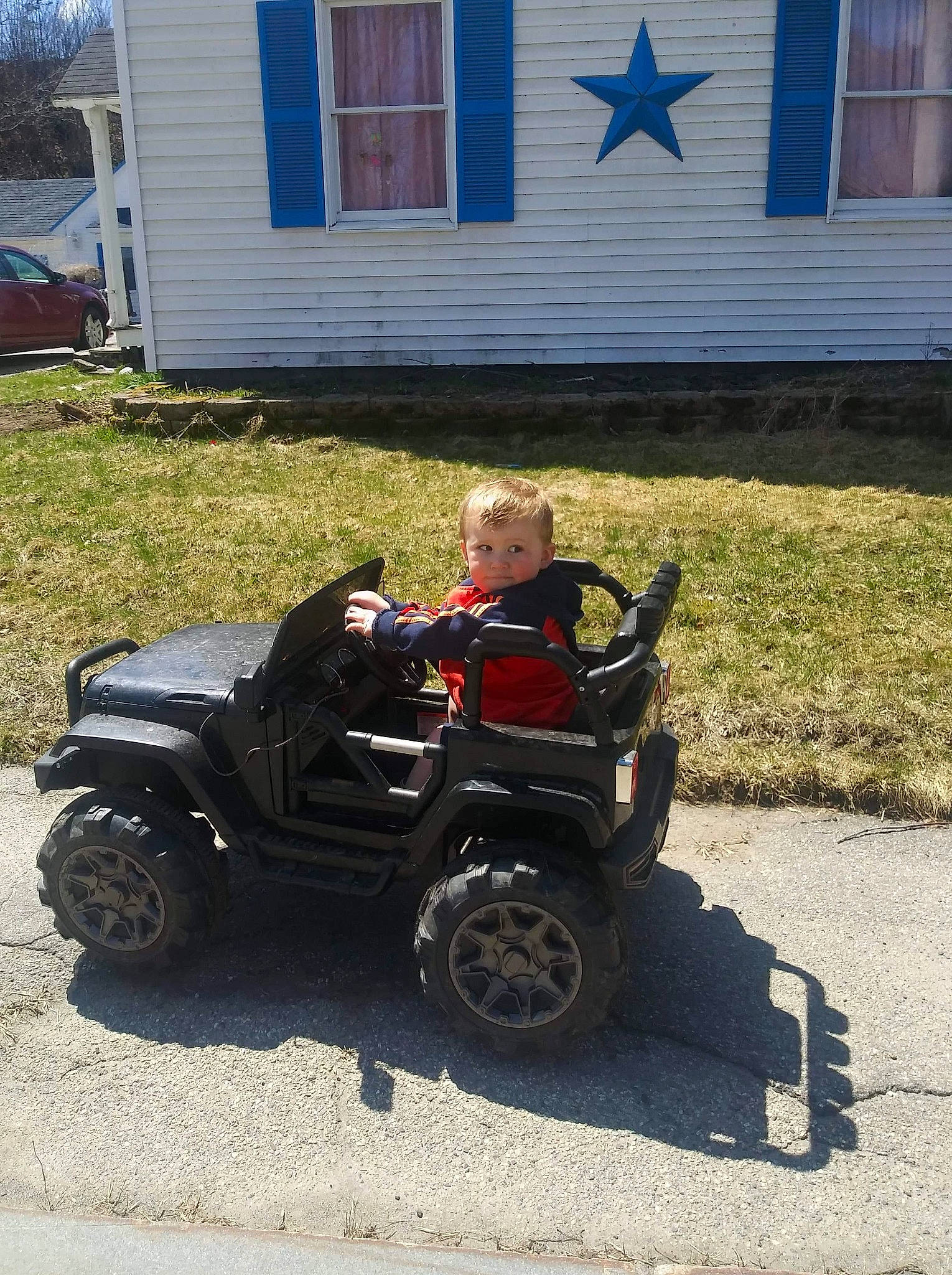 Louis is registered to the contest to win money with this photo: all_terrain_vehicle, auto_part, automotive_exterior, automotive_tire, automotive_wheel_system, automotive_window_part, car, fender, jeep, land_vehicle, off_road_vehicle, person, rim, tire, vehicle, wheel