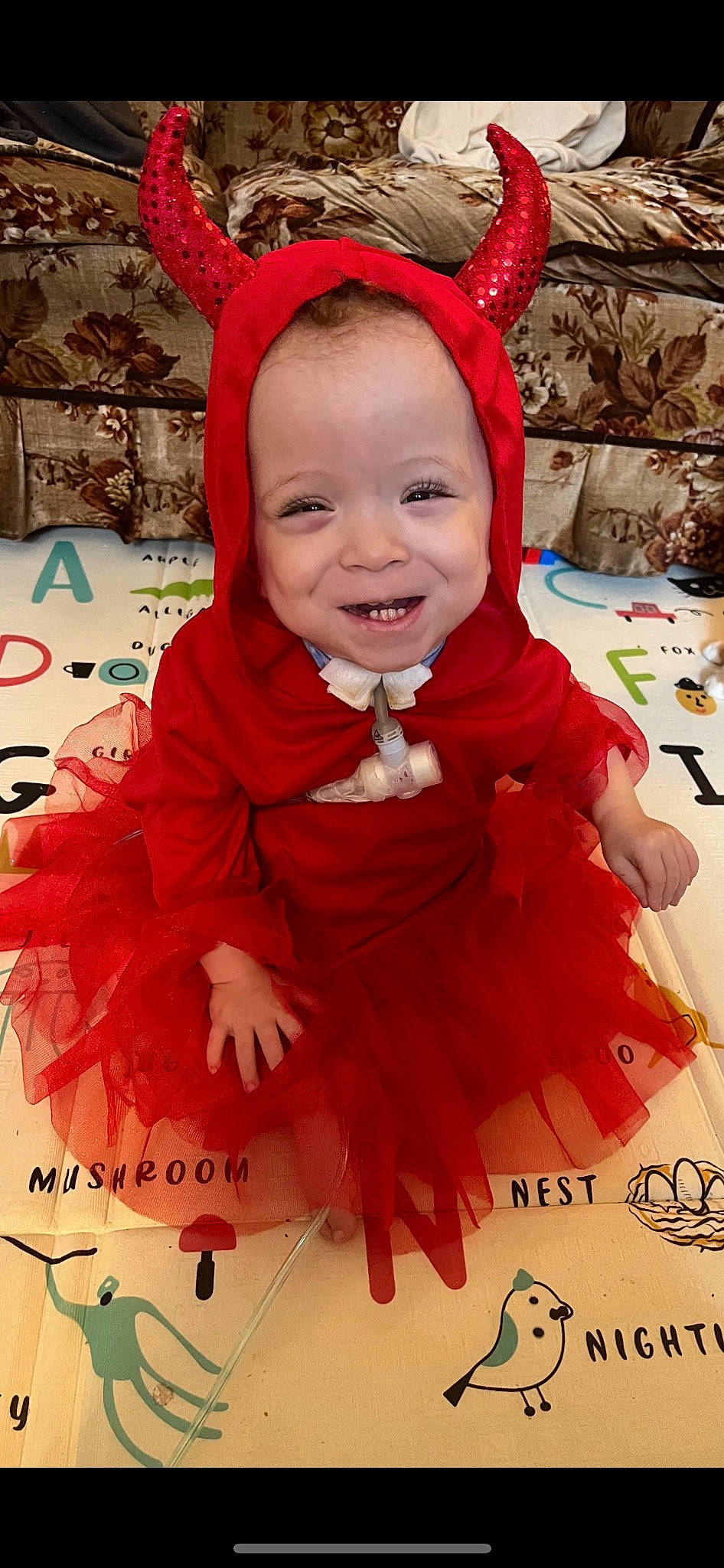 Serenitie is registered to the contest to win money with this photo: baby, baby_toddler_clothing, child, costume_hat, event, facial_expression, fashion_accessory, fun, happy, headband, magenta, peach, person, photograph, pink, product, red, smile, textile, toddler