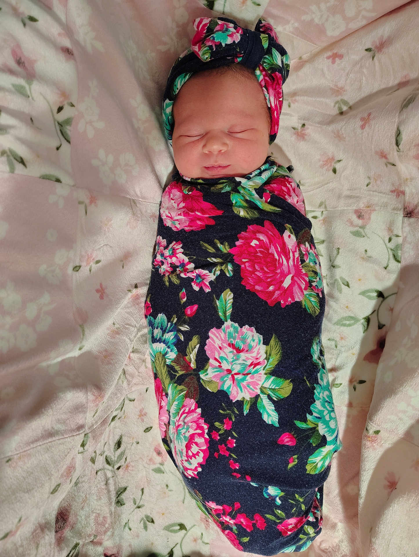 Meredith is registered to the contest to win money with this photo: newborn, baby, swaddle, floral, blanket, headband, sleeping, infant, portrait, cute, soft, cozy, resting, child, pattern, fabric, bed, comfort, peaceful, young