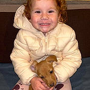 Fifille a rejoint le concours — aidez-le/la à gagner de superbes lots ! child, cozy, cute, dog, eyes, face, happy, heart_pattern, hugging, indoors, jacket, love_text, pajamas, pet, puppy, red_hair, sitting, smiling, warm_clothing, young