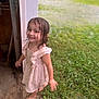 child, girl, wet_hair, dress, barefoot, smiling, outdoor, grass, doorway, happy, young, person, nature, playful, summer, daylight, portrait, motion, cute, casual