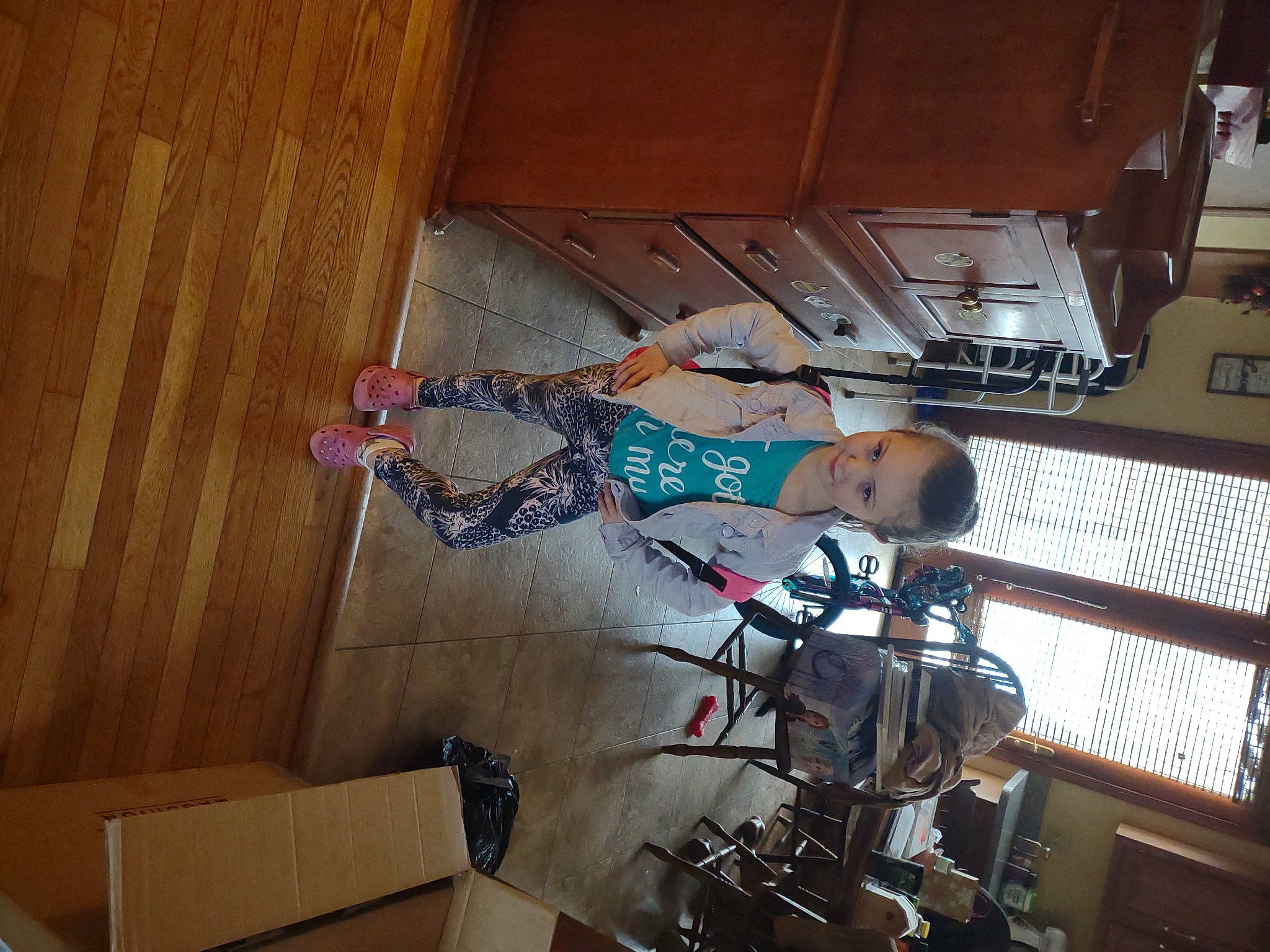 Hailee is registered to the contest to win money with this photo: building, ceiling, elbow, engineering, flooring, fun, hardwood, human_leg, machine, metal, person, plywood, room, space, t_shirt, thigh, varnish, wood, wood_flooring, wood_stain