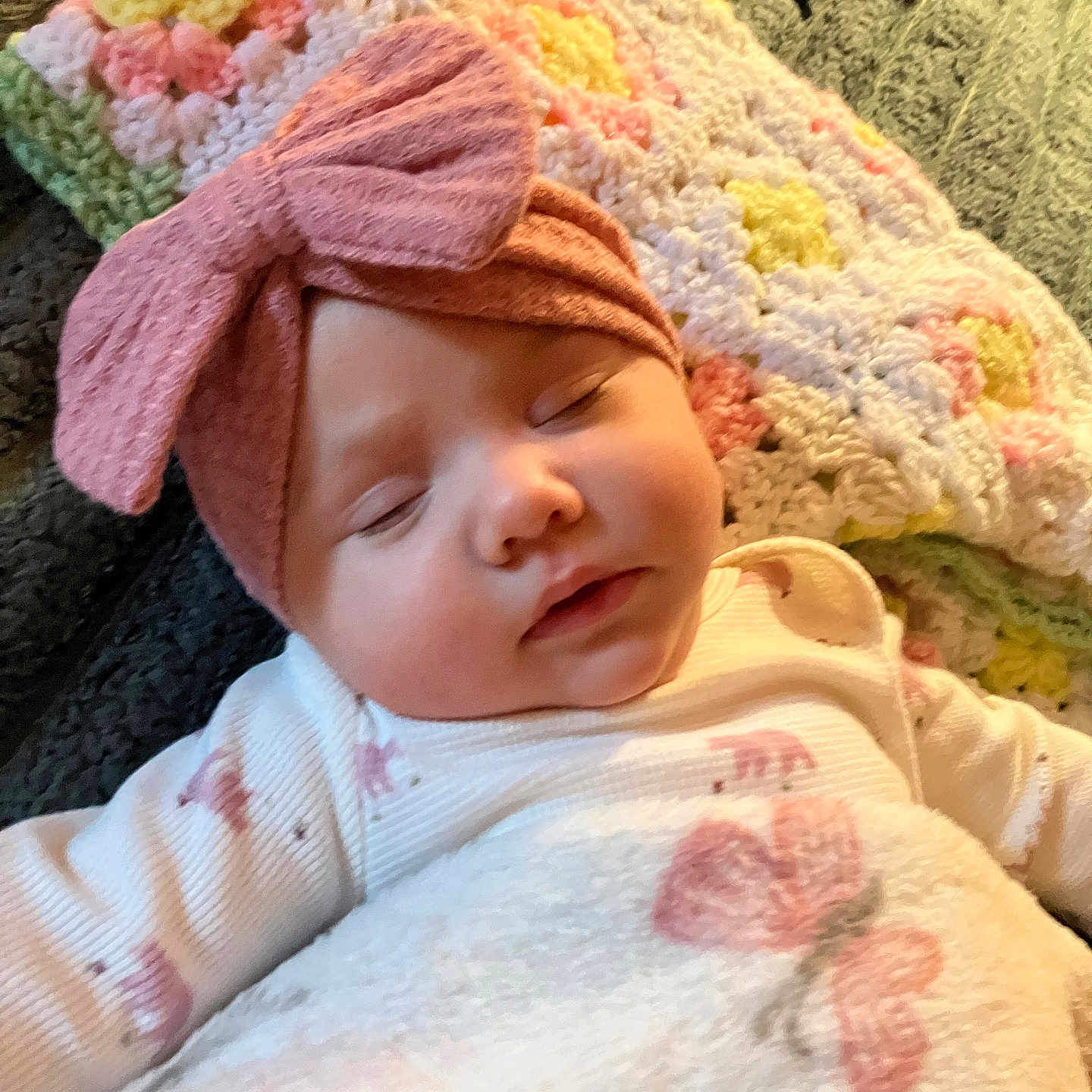 Zanica is registered to the contest to win money with this photo: baby, blanket, bow, child, closeup, clothing, cozy, crocheted_blanket, face, green, headband, indoors, infant, peaceful, pink, rest, sleeping, soft, white, yellow