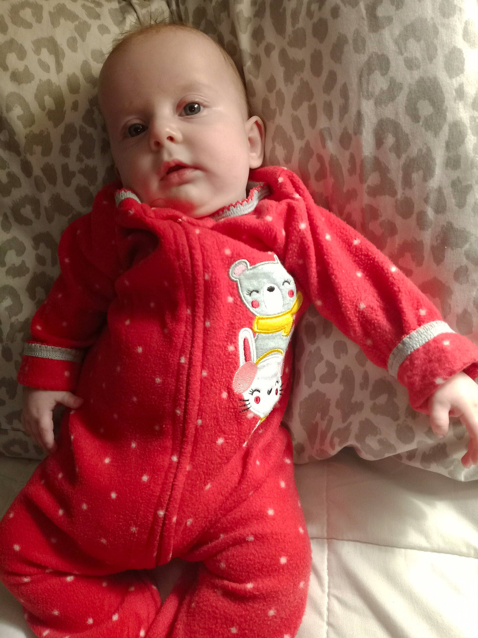 Karma is registered to the contest to win money with this photo: baby, baby_toddler_clothing, cheek, child, collar, comfort, eye, flooring, jacket, linens, lip, nose, outerwear, pattern, person, pink, sitting, skin, sleeve, textile