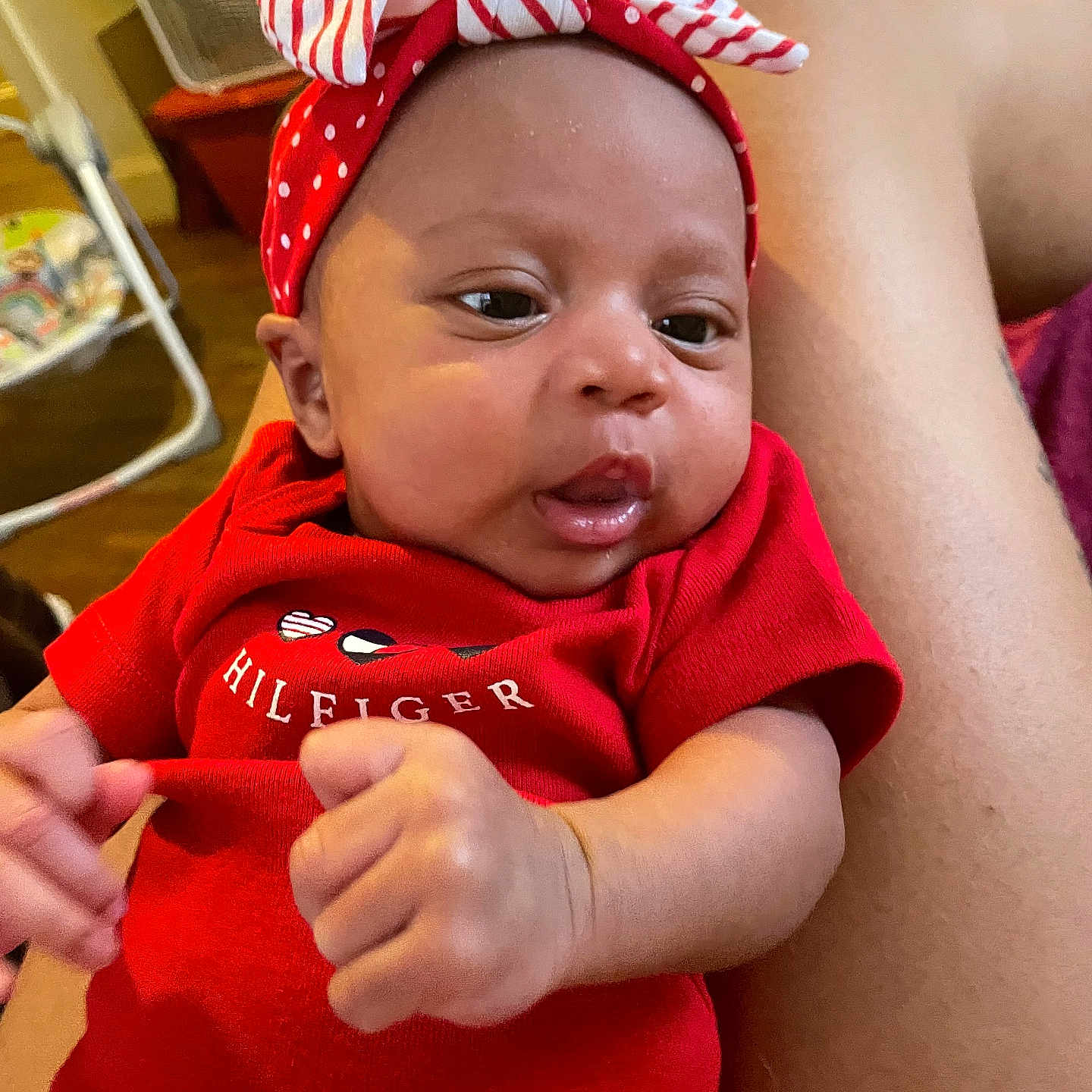 Jurmani joined the competition — help win amazing prizes! baby, casual, closeup, curious, cute, face, furniture, headband, home, human_hand, indoor, infant, leg, person, polka_dot, portrait, red_clothing, resting, skin, striped
