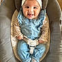 Almà participe au concours pour gagner de l'argent avec cette photo : baby, infant, smiling, headband, denim_overalls, baby_seat, child, cute, happy, indoors, clothing, socks, face, person, seatbelt, comfort, portrait, young_child, playful, tongue_out