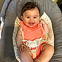 baby, smiling, onesie, baby_swing, straps, happy, infant, cute, child, seat, indoor, person, face, legs, feet, clothing, baby_girl, comfort, safety, closeup