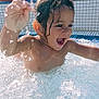 Abraham participe au concours pour gagner de l'argent avec cette photo : child, toddler, water, splash, pool, happy, wet_hair, outdoor, summer, joy, play, bubbles, greenery, tile, sunlight, person, fun, splashing, excited, nature