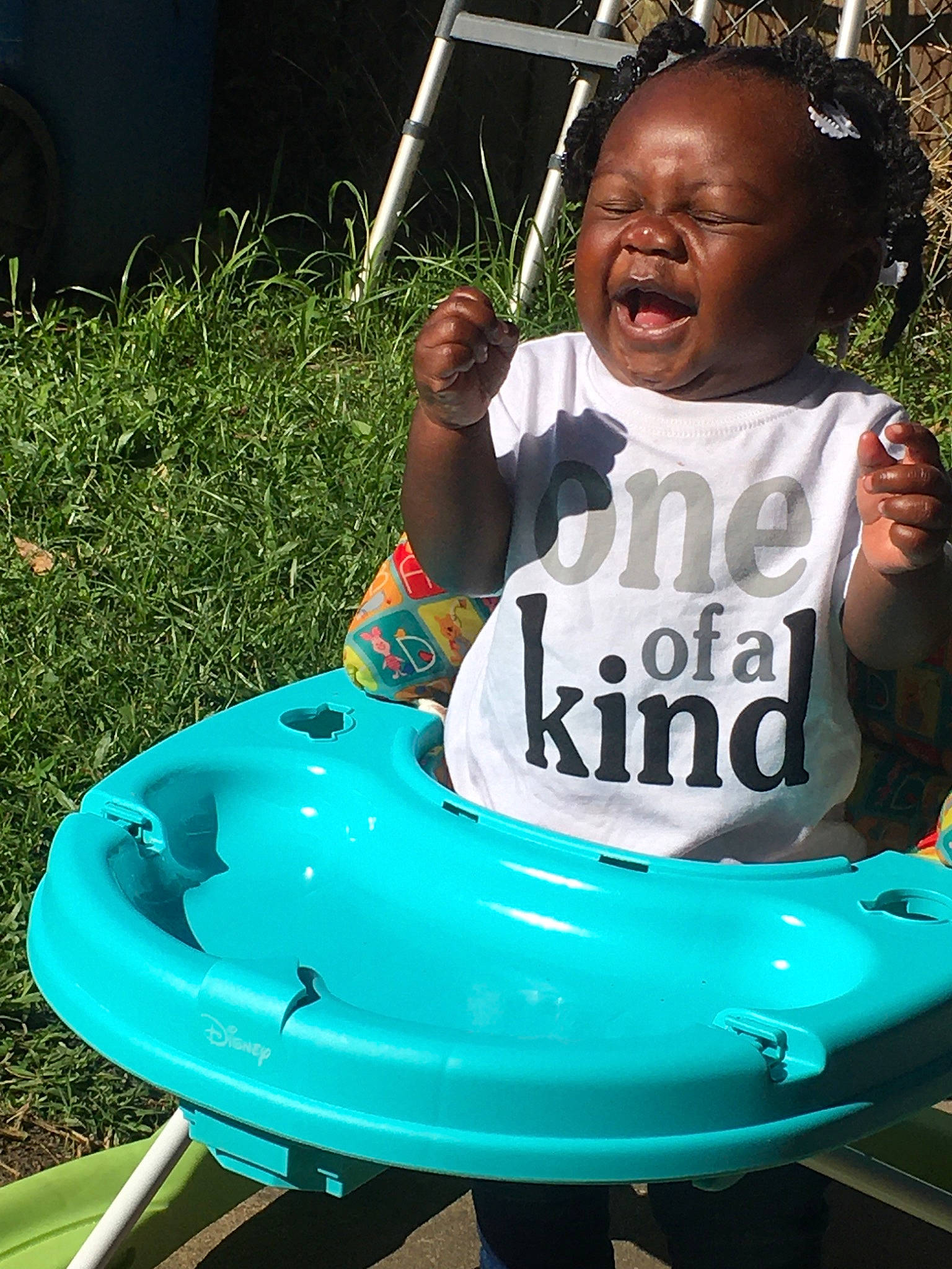 Jasiah is registered to the contest to win money with this photo: automotive_exterior, boats_and_boating_equipment_and_supplies, bumper, child, fun, grass, green, happy, leisure, motor_vehicle, natural_environment, outdoor_play_equipment, person, play, recreation, t_shirt, toddler, vacation, water, water_transportation