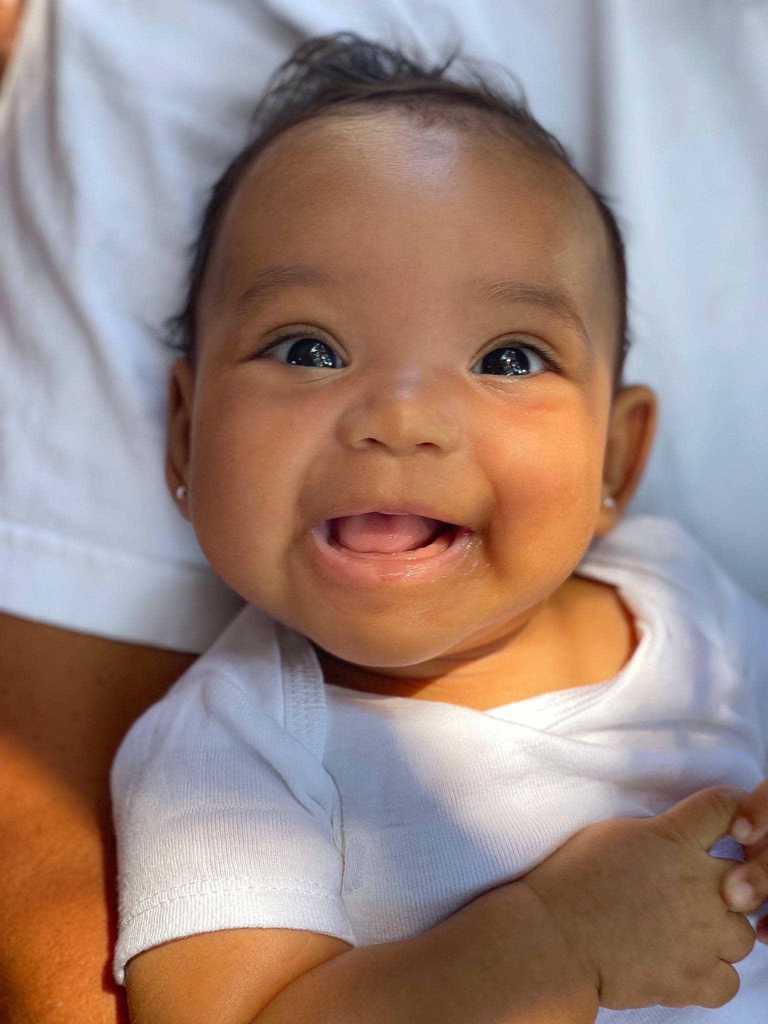 Kensley is registered to the contest to win money with this photo: baby, baby_toddler_clothing, cheek, comfort, eyebrow, eyelash, finger, flash_photography, gesture, hand, happy, iris, joy, lip, mouth, nose, person, skin, sleeve, smile