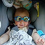 baby, blanket, blue, car_seat, child, clothing, comfort, cozy, cute, cute_baby, hand, indoor, infant, person, portrait, reflection, seatbelt, smile, soft_texture, sunglasses