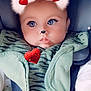 adorable, baby, blanket, blue_eyes, car_seat, child, closeup, cute, digital_filter, ears, expression, face, green_clothing, heart, indoor, infant, nose, portrait, soft_texture, sparkles